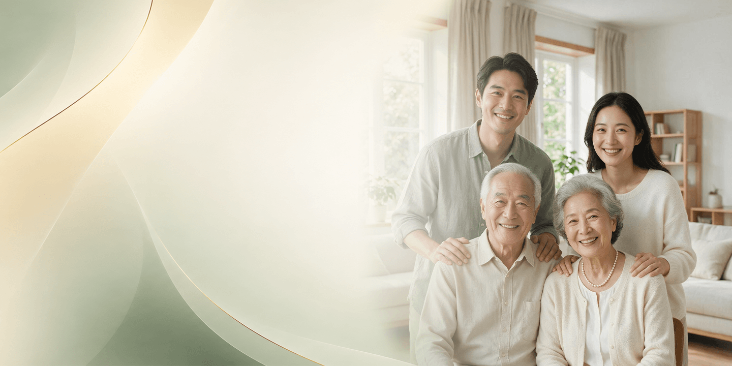 Multi-generational Asian family smiling in warm ambient light representing health and longevity